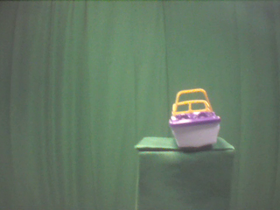 270 Degrees _ Picture 9 _ Purple and Yellow Toy Boat.png
